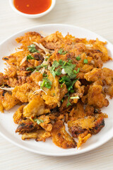 Crispy fried mussel pancake with egg