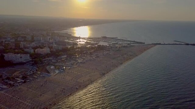 Aerial View of the Beach between Rimini and Riccione in Emilia Romagna At Sunset In Italy - drone shot