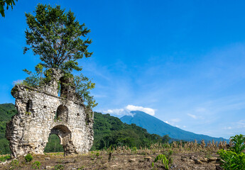 Fototapeta na wymiar Ruins of an abandoned church on the Guatemalan Bocacosta (or Boca Costa) – the transition zone between the warm regions of the tropical plains and the cold heights of the foothills 