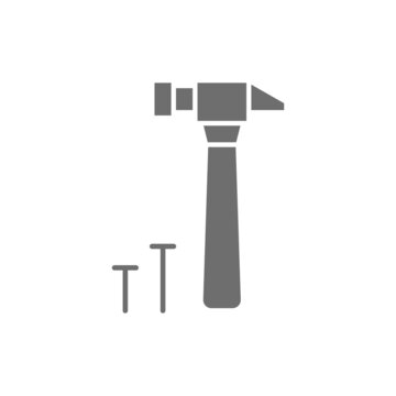 Hammer and nails, building tools grey icon.