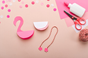 DIY. Children's pink flamingo made of colored paper. Detailed step-by-step instructions.