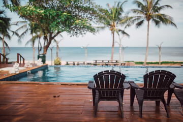 deckchairs on swimming pool.Luxury swimming pool.