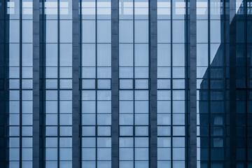 Low angle looking up at the glass curtain wall of high-rise buildings in the urban business district, Shanghai, China - obrazy, fototapety, plakaty