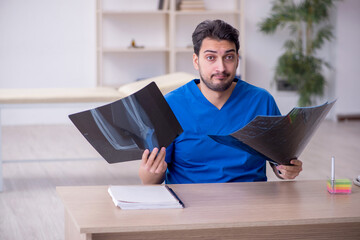 Young male doctor radiologist working in the clinic