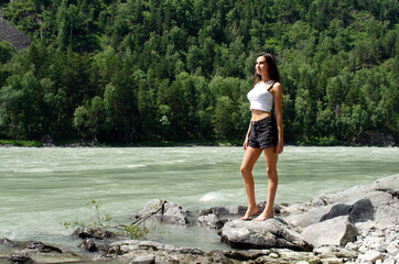 beautiful woman on the background of mountain nature