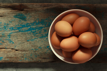 An image top view or flat lay egg easter heaped in a cup is a fresh treat for farm chicken with...