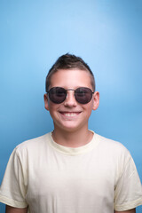 Portrait of Boy in sun glasses , smiling. Emotional face