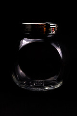 Unique elegant transparent bottle in black background in HD size