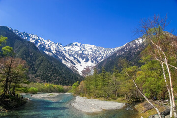 Kamikochi National Park in the Northern Japan Alps of Nagano Prefecture, Japan. Beautiful snow mountain with river.  One of the most beautiful place in Japan.