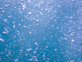 Fototapeta na wymiar Underwater bubbles, under the Mediterranean sea, very suitable landscape picture for backgrounds, blue background of underwater bubbles.
