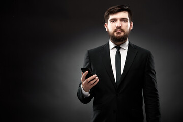 Portrait of businessman with smart phone