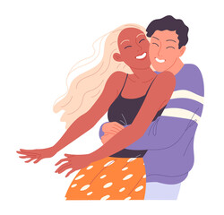 Young man hugs the girl from behind and they are happy