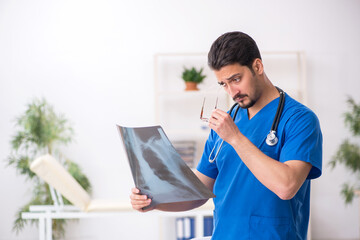 Young male doctor radiologist working in the clinic