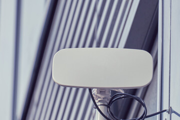 Outdoor internet access point on the wall of an office building