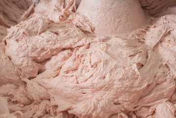 kneading and grinding minced meat at a meat processing plant