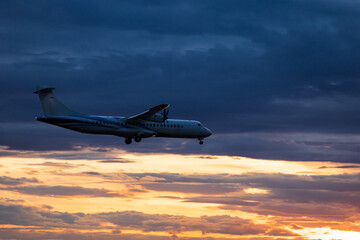 Passenger jet plane in the sky. Airplane flies high above the clouds.