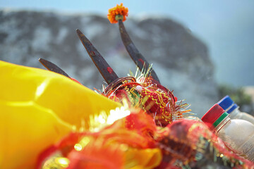 Closeup of Trishul in a hindu temple along with other items