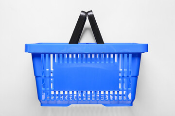 Shopping basket on light background