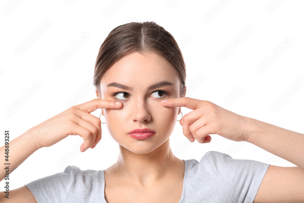 Wall mural Beautiful young woman doing facial yoga on white background