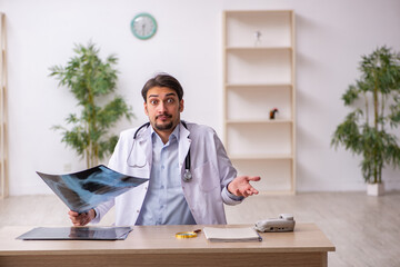 Young male doctor radiologist working in the clinic