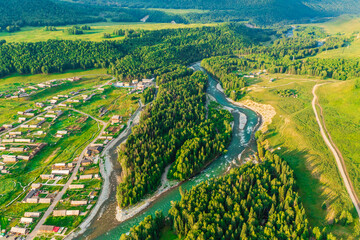 Fototapeta na wymiar Beautiful Hemu Village with natural scenery in Xinjiang,green forest and river.Hemu Village is a famous travel destination in China.Aerial view.