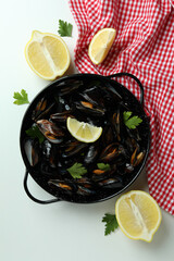 Concept of delicious food with mussels on white background