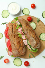 Concept of tasty eating with ciabatta sandwiches on white background
