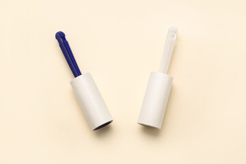 Lint rollers on color background