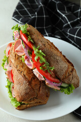 Plate with tasty ciabatta sandwiches, close up