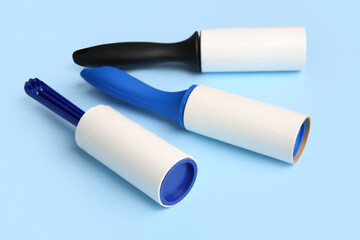 Different lint rollers on color background