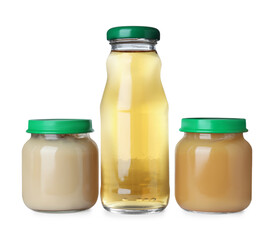 Baby food in jars near bottle of juice on white background