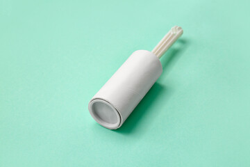 Lint roller on color background