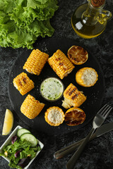 Concept of tasty food with grilled corn