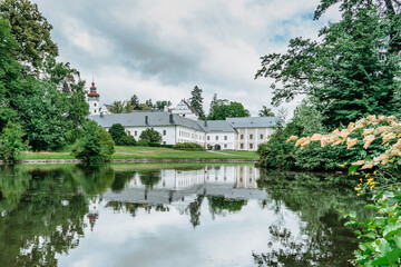 Fototapeta na wymiar Velke Losiny Castle in Czech spa town,East Bohemia,Jeseniky Mountains,Czech Republic.Romantic Renaissance chateau with sgraffito decoration reflected in water,surrounded by beautiful park.Travel scene