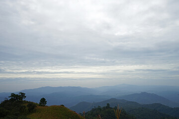 Natural landscape of green mountain range with cloudy blue sky