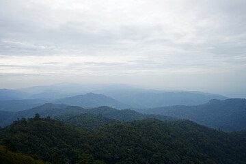 Natural landscape of green mountain range with cloudy blue sky