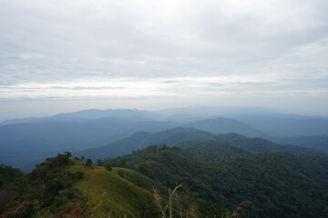 Fototapeta premium Natural landscape of green mountain range with cloudy blue sky
