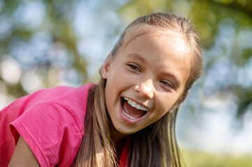 Face of enthusiastic pretty girl with toothy smile