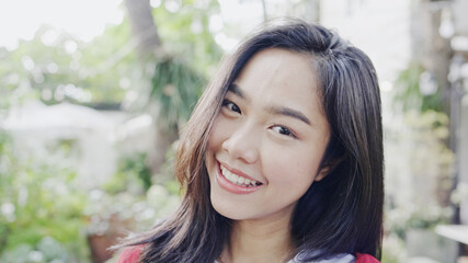 Fototapeta premium Face Beautiful Asian teenage woman smiling happy. good mental health positive thinking about lifestyle. good dental health. looking at camera