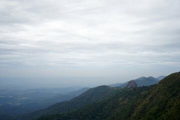 Natural landscape of green mountain range with cloudy blue sky