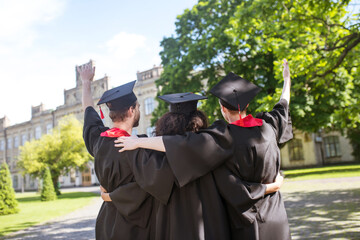 A group of graduates in the park feeling great and excited