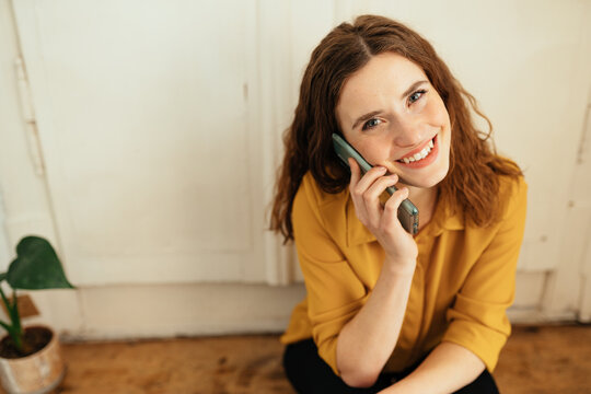 Attractive young woman chatting on her smartphone