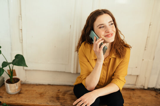 Young woman listening to a call on her mobile phone