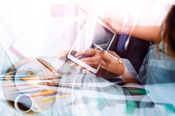 Businesswoman working on laptop computer sitting at home with a dog pet and managing her business via home office during Coronavirus or Covid-19 quarantine