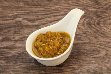 Green spicy sauce in the bowl