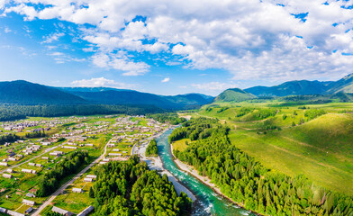 Beautiful Hemu Village with natural scenery in Xinjiang,green mountain and forest with rivers.Hemu Village is a famous travel destination in China.Aerial view.