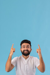 Fototapeta premium A HAPPY BEARDED MAN POINTING FINGERS ABOVE
