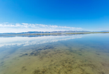 Reflection on Song Kul lake, Kyrgyzstan