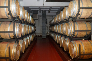 Barrels for storing wine in the cellars of the winery.