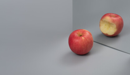 Apple reflecting in the mirror ,Cheating concept